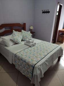 Cama ou camas em um quarto em Hotel Lumiar