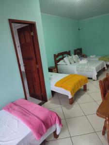 Cama ou camas em um quarto em Hotel Lumiar
