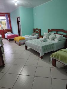 Cama ou camas em um quarto em Hotel Lumiar