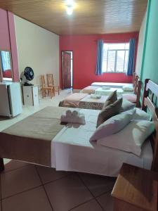 Cama ou camas em um quarto em Hotel Lumiar
