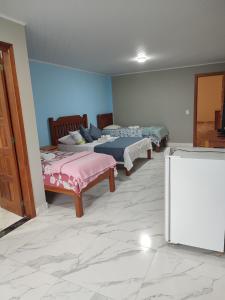 Cama ou camas em um quarto em Hotel Lumiar