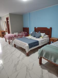 Cama ou camas em um quarto em Hotel Lumiar