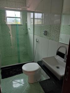 Um banheiro em Hotel Lumiar