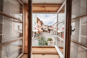 an open window with a view of a city street at Ferienwohnung Alter Brotladen in Melk