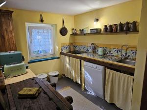 a kitchen with a sink and a counter top at Apartment Ad Alta Obervellach in Obervellach
