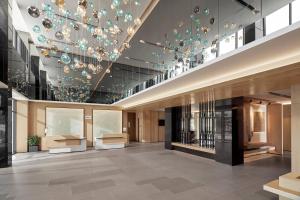a lobby of a building with a chandelier at Fairfield by Marriott South Binh Duong in Thuan An