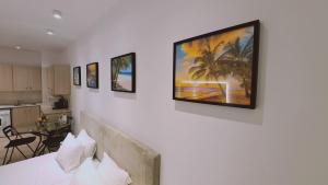 a bedroom with a tv on a wall at STAY Napa Velvet Apartment in Ayia Napa