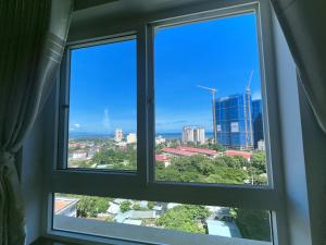a window with a view of a city at Ngọc Duyên Homestay- Central Vung Tau, near Lotte Mart in Vung Tau