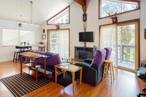 a living room with a couch and a table at Zen Amongst the Trees in Truckee