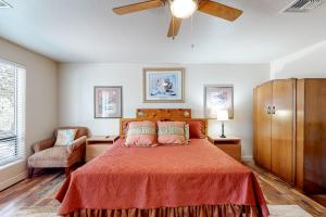 a bedroom with a bed and a ceiling fan at Hidden Valley Haven - Unit B in Prescott