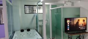 Um banheiro em Hotel Lumiar
