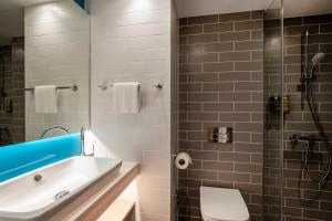 a bathroom with a tub and a sink and a shower at Holiday Inn Express Liverpool - Central, an IHG Hotel in Liverpool