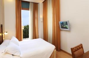 A bed or beds in a room at Bella Venezia