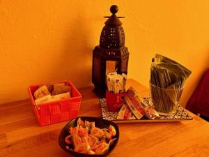 a table with a plate of food and a coffee maker at B&B La Casa del Barbiere in Modena