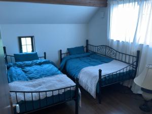 Postel nebo postele na pokoji v ubytování レンタルヴィラ岐阜各務原-8名宿泊可-ペット可