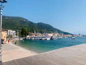 a group of boats docked in a harbor at LaMonica.House in Salò