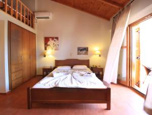 Postel nebo postele na pokoji v ubytování Xenios Apartments