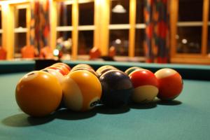 a group of billiard balls on a pool table at Dovreskogen Gjestegård AS in Dovreskogen