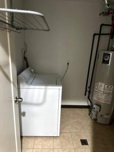 a white washer and dryer in a room at Duplex Apartment In Bayonne NEW JERSEY. up to 4 peoples. in Bayonne