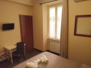 Letto o letti in una camera di Domina Popolo