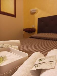 Letto o letti in una camera di Domina Popolo