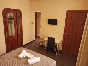 Letto o letti in una camera di Domina Popolo