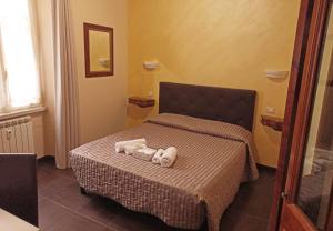 Letto o letti in una camera di Domina Popolo