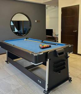 a pool table in a room with a mirror at Ipoh 19A Villa for 12pax 6 Carpark with BBQ by IWH in Ipoh