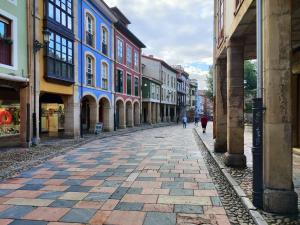 a cobblestone street in a city with buildings at Los Caños de Rivero, con GARAJE y WIFI, VUT-4366-AS in Avilés