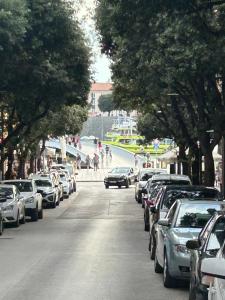 a street with cars parked on the side of the road at Apartment Rocky II in Zadar