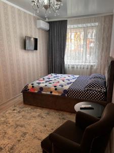 Ένα ή περισσότερα κρεβάτια σε δωμάτιο στο Квартира гостиничного типа VIP Jaŋa Qala