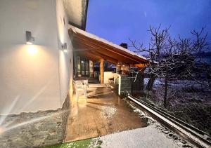 a building with a porch with a light on it at Chalet Grotta Monte Etna in Maletto