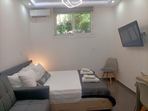 A bed or beds in a room at Central Bachelor