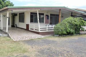 a small house with an american flag on it at Faatau House 3 bedrooms and big living room in Papeete