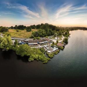 an aerial view of a house on an island in the water at Modern boutique apartment for 4- central Ellesmere in Ellesmere