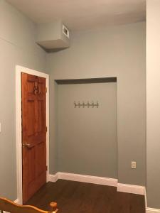 an empty room with a door and a wall with a closet at CoHi - 102 in Washington