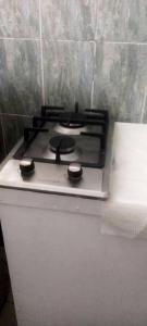 a stove top oven sitting on top of a counter at Studio a Grand Popo a 10 m de la plage avec piscine partagee jardin clos et wifi in Grand-Popo