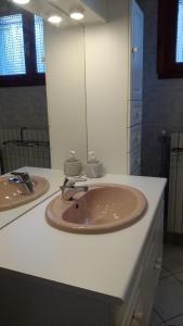 a bathroom with two sinks and a large mirror at Villa Soleil 12 rue Joseph Mathieu in Guillestre +3 photos