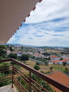 a view of a city from the balcony of a house at Casa Na Montanha Da Neve in Seia