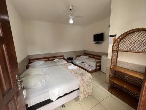 Postel nebo postele na pokoji v ubytování Pousada Villa Real Paraty - Localização e café da manhã EXCELENTES"