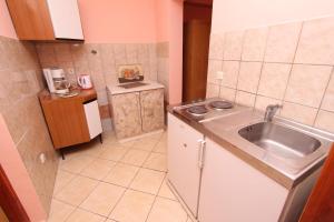a small kitchen with a sink and a counter at Apartments Grace in Rovinj +31 photos