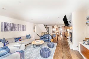a living room with a couch and a table at 330 W Pacific B townhouse in Telluride