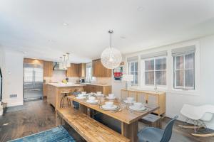 a kitchen with a wooden table and a dining room at 330 W Pacific B townhouse in Telluride
