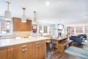a kitchen with a table and a dining room at 330 W Pacific B townhouse in Telluride