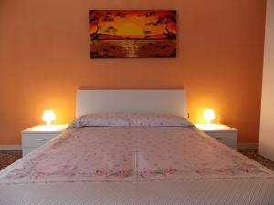 A bed or beds in a room at Appartamenti Blue House