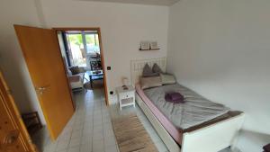 a bedroom with a large bed in a room at Auszeit im Pott - Ferienwohnung Lavendel in Herten
