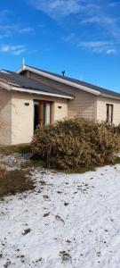 a house with snow in front of it at MI CASA in El Calafate