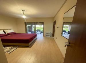 a bedroom with a bed and a table and chairs at Condo à Prestigia Agate - Golf city Marrakech in Marrakesh