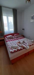 Voodi või voodid majutusasutuse Orchidea Apartman toas