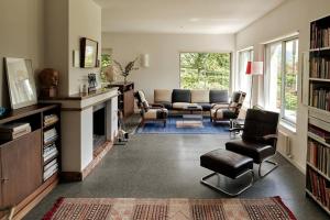 a living room with a couch and a fireplace at Casa Navegna in Minusio